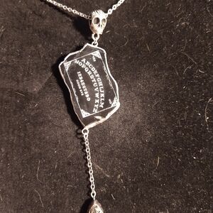Marble engraved ouija board with planchette necklace